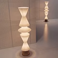 Modern Layered Floor Lamp With White Shade And Wooden Base In Minimalist Interior