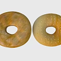 Two Different Delicious Donuts With Golden Brown And Light Golden Surfaces