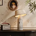Marble Table Lamp With Beige Lampshade And Vintage Radio On Floral Wallpaper Background