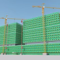 Modern Construction Site With High Rise Buildings Green Scaffolding And Tower Cranes