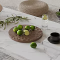 Fresh Limes On Wooden Tray Over Marble Surface With Greenery And Water Glass