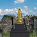 Golden Guanyin Sculpture with Rocky Background Blue Sky and Green Plants