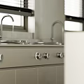 Modern Industrial Kitchen With Gray Cabinets Long Countertop And Window Blinds