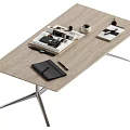 Modern Coffee Table Featuring Wooden Top Metal Legs Magazines Notebook Pen And Mug