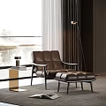 Brown Leather Lounge Chair With Ottoman And Floor Lamp In Modern Interior With Natural View