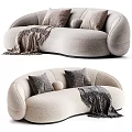 Cozy Beige Sectional Sofa With Curved Design Plush Pillows And Soft Throw Blanket