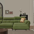 Green Velvet Three Seater Sofa With Accent Pillows And Wall Art In Living Room