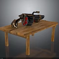 Heavy Weapon With Red Circular Details Metallic Body And Brown Grip On Simple Wooden Table