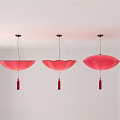 Three Red Petal Shaped Chandeliers With Tassels Hanging From White Ceiling
