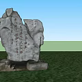 Outdoor Rockery Stone With Chinese Inscriptions Surrounded By Green Grass And Trees