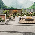 Lush Courtyard Garden With Wooden Deck Fire Pit Outdoor Furniture And Colorful Flowers
