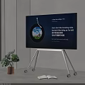 Modern Portable TV on Wheel Stand Displaying Content in Indoor Space With Green Plant