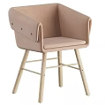 Modern Light Pink Upholstered Lounge Chair With Wooden Legs And Armrest Design Details