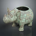 Antique Bronze Rhinoceros Shaped Decorative Vessel With Green Patina And Classic Design