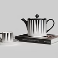 Modern Black And White Striped Tea Set With Teapot Teacup And Saucer On Books