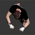 Man In Black T Shirt And Yellow Shorts With White Boxing Gloves Training Stance