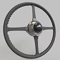 Classic Car Steering Wheel With Textured Grip And Metallic Center Spokes