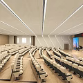 Large Modern Conference Room Interior Design With Tiered Seating And Projector Screen