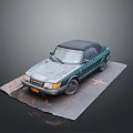 Vintage Green Convertible Car Parked On Damaged Gray Mat Surface
