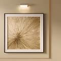 Gold Abstract Oil Painting with Radiant Texture in Black Frame on Beige Wall and Wall Light