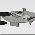 White Round Tabletop Coffee Table With Small Black Side Table And Magazines Plates Wine Glasses 3d model