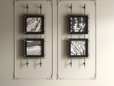 Four Black And White Abstract Paintings With Decorative Metal Hooks Hanging On Light Colored Wall 3d model