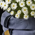 Decorative Bonsai Potted Plant with White Daisy Flowers in Gray Cloth Bag and Tag