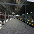 Train Station Platform With Covered Roof Green Train And Tiled Floor