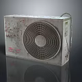 Vintage Rusty Air Conditioner Fan Featuring Circular Grille And Metal Body On Reflective Surface