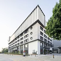 Modern Industrial Factory Building Exterior With Geometric Roof And Large Windows