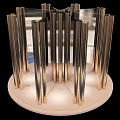 Elegant Modern Display Shelf With Metallic Columns Circular Base And Soft Lighting For Luxury Items