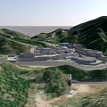 Scenic Aerial View of Green Mountain Valley With Roads and Buildings