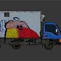 Blue Truck With White Cargo Container Featuring Colorful Cartoon Graffiti Design