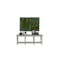 Lush Green Plant Wall In Indoor Space With White Vase Picture Frame And Decorative Items