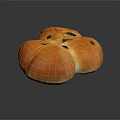 Golden Flower Shaped Raisin Bread With Shiny Crust On Black Background