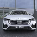 White Modern Sedan With Sleek Exterior And Stylish Front Grille Design