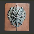 Antique Bronze Mythical Beast Head Door Knocker On Wooden Panel