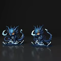 Two Blue Fantasy Monster Figures With Horns Tentacles And Glowing Eyes On Dark Reflective Surface