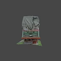 Green and Red Hull Yacht Covered with Tarpaulin on Stands in Grass Area