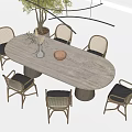 Oval Light Gray Dining Table Set With Rattan Chairs Black Seats Vase And Tree
