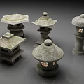 Japanese Style Stone Outdoor Lights with Various Designs Roof Like Tops and Lit Windows