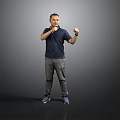Man In Dark Blue Shirt Gray Pants Posing With Boxing Gestures On Gray Background
