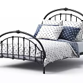 Black Metal Single Bed with Curved Frame White Patterned Linens and Navy Pillows