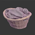 Wicker Storage Basket Containing Soft Gray Cloth For Daily Household Items