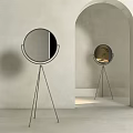 Round Floor Mirror With Tripod Metal Stand In Minimalist Interior Design