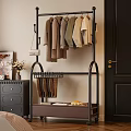 Modern Black Metal Clothes Rack Design With Hanging Sweaters Shirts And Handbag For Home Bedroom