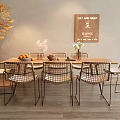 Wooden Dining Table Set with Rattan Chairs Decorative Sign and Yellow Foliage Plant
