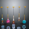 Multiple Colorful Hanging Decorative Objects With Yellow Tops Black Strings And Transparent Parts
