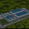 Industrial Factory Complex With Multiple Buildings Blue Roofs And Green Surrounding Trees