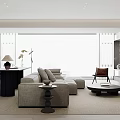 Minimalist Living And Dining Room With Gray Sofa Round Coffee Table And Dining Table